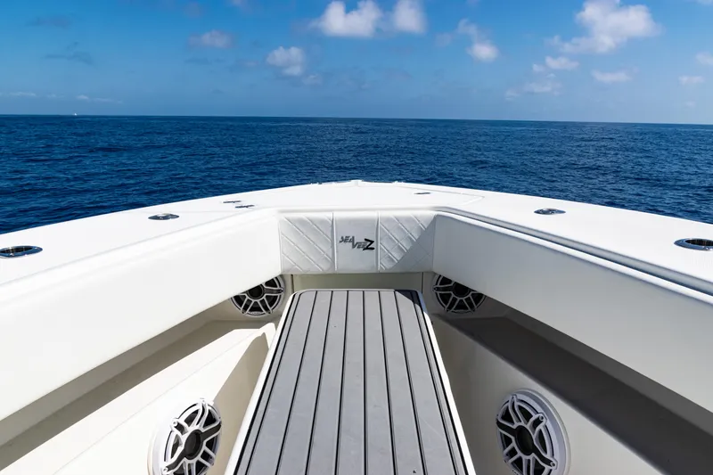 Slide: The Image of 2019 SeaVee 390Z boat deck with ocean view, clear sky, and speaker system. - 17
