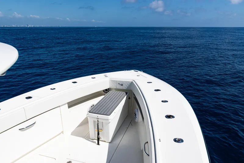 Slide: The Image of 2019 SeaVee 390Z boat on open ocean, clear skies, and calm waters. - 19
