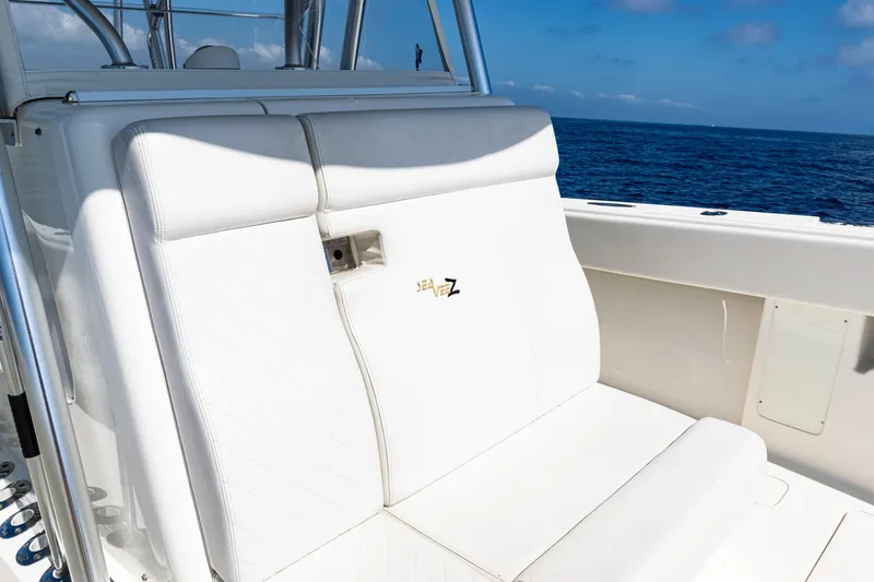 Slide: The Image of 2019 SeaVee 390Z boat with white seating, ocean view in background. - 23