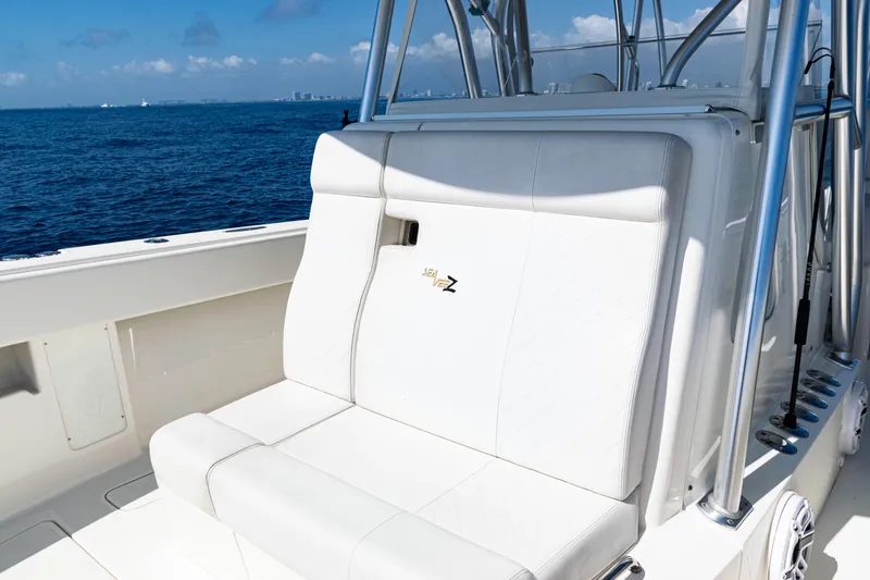 Slide: The Image of 2019 SeaVee 390Z boat with white seating, ocean backdrop, and clear skies. - 24