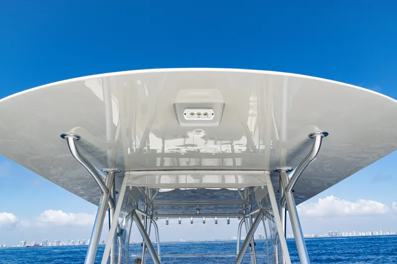 Slide: The Image of 2019 SeaVee 390Z boat canopy against clear blue sky and ocean backdrop. - 25