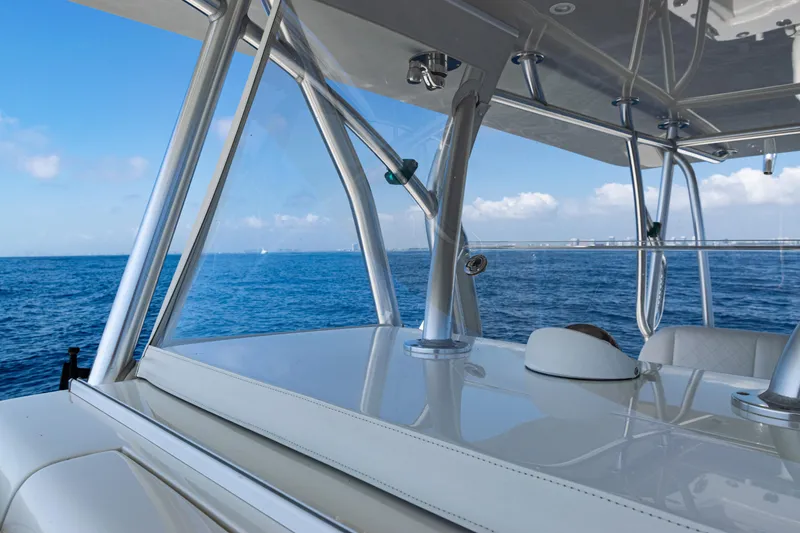 Slide: The Image of 2019 SeaVee 390Z boat interior with ocean view, showcasing sleek design and clear skies. - 29