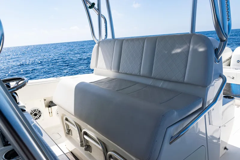 Slide: The Image of 2019 SeaVee 390Z boat interior with cushioned seating, ocean view in background. - 33