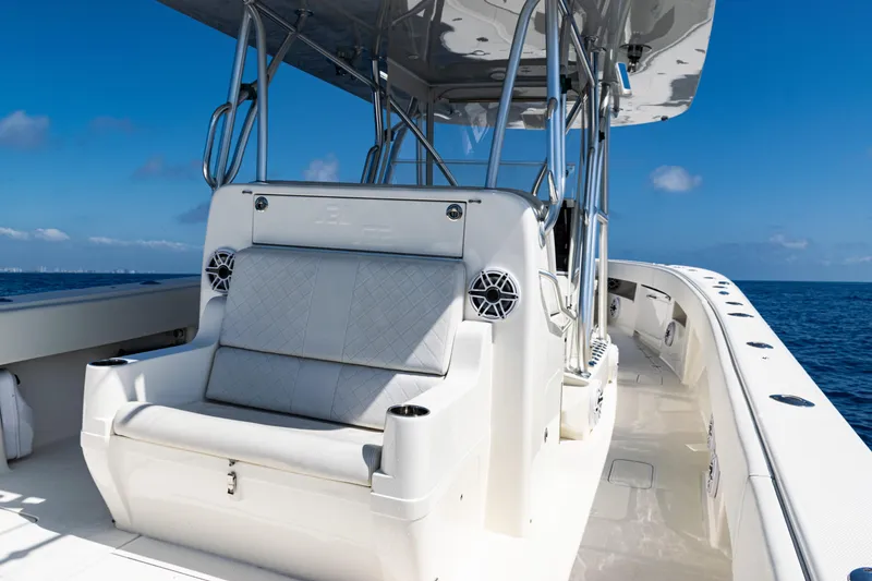 Slide: The Image of 2019 SeaVee 390Z boat interior with seating, ocean view, and clear blue sky. - 37
