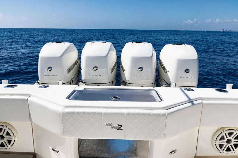Slide: The Image of 2019 SeaVee 390Z boat with four powerful Mercury outboard engines on open sea. - 39