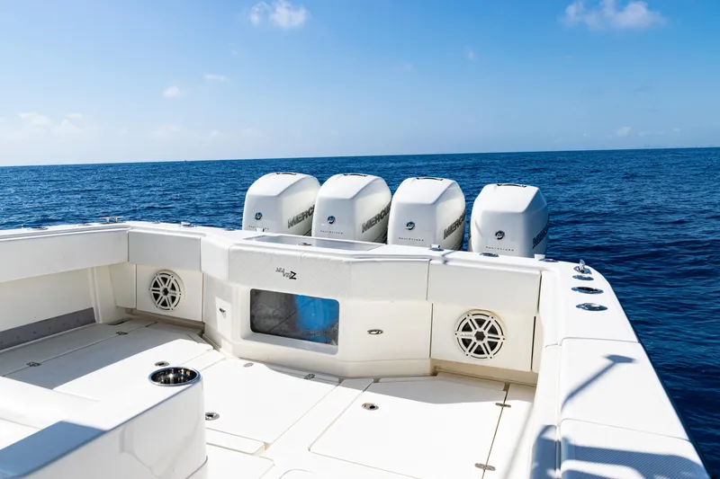 Slide: The Image of 2019 SeaVee 390Z boat with four outboard engines on open ocean. - 40