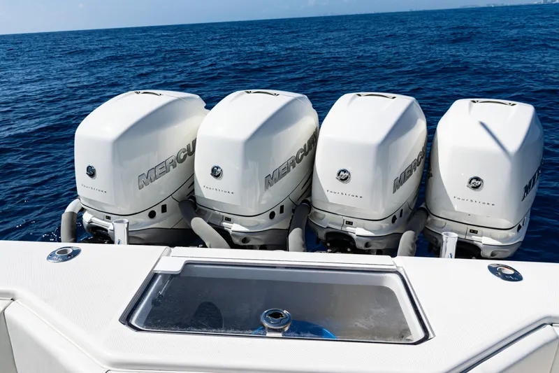Slide: The Image of 2019 SeaVee 390Z boat with four Mercury outboard engines on open water. - 41
