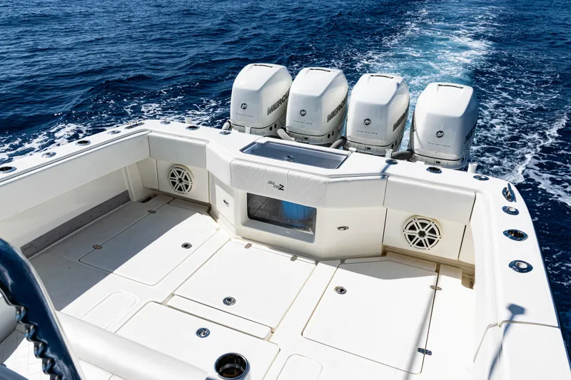 Slide: The Image of 2019 SeaVee 390Z boat with four powerful outboard engines on open ocean. - 42