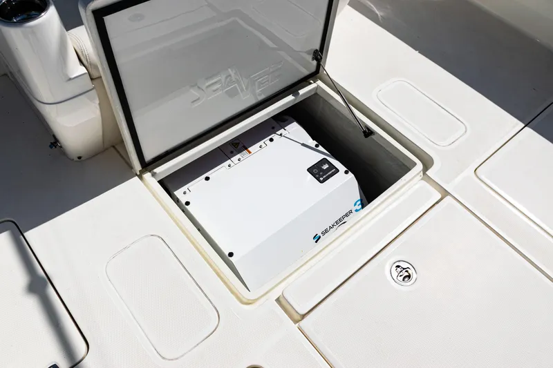 Slide: The Image of 2019 SeaVee 390Z boat cruising on open ocean under clear blue sky. - 6