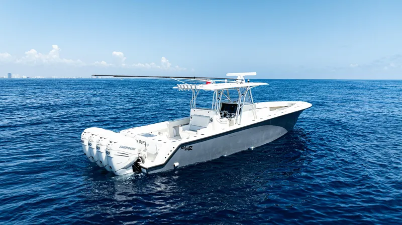Slide: The Image of 2019 SeaVee 390Z boat on open ocean, clear blue sky, calm waters. - 9