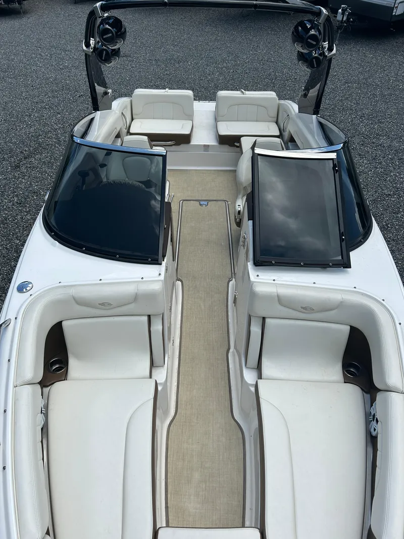 Slide: The Image of 2016 Chaparral 257 SSX boat interior with white seating and sleek design. - 20
