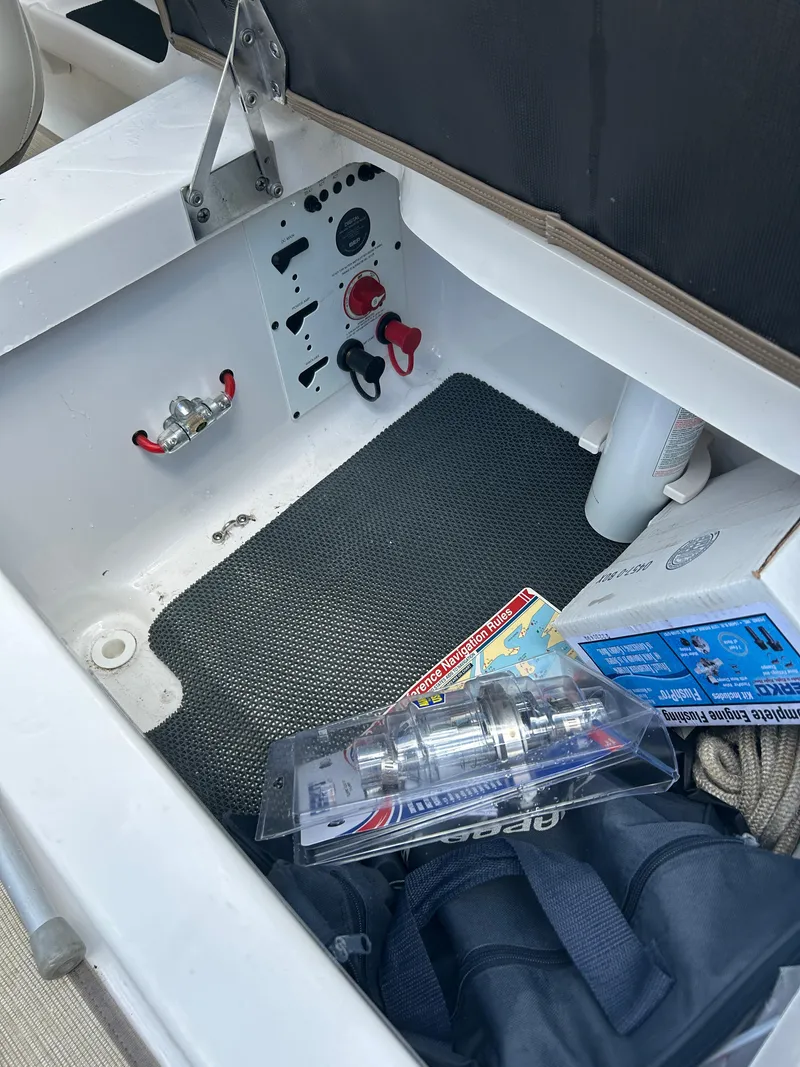 Slide: The Image of Storage compartment of a 2016 Chaparral 257 SSX boat with accessories and equipment. - 23