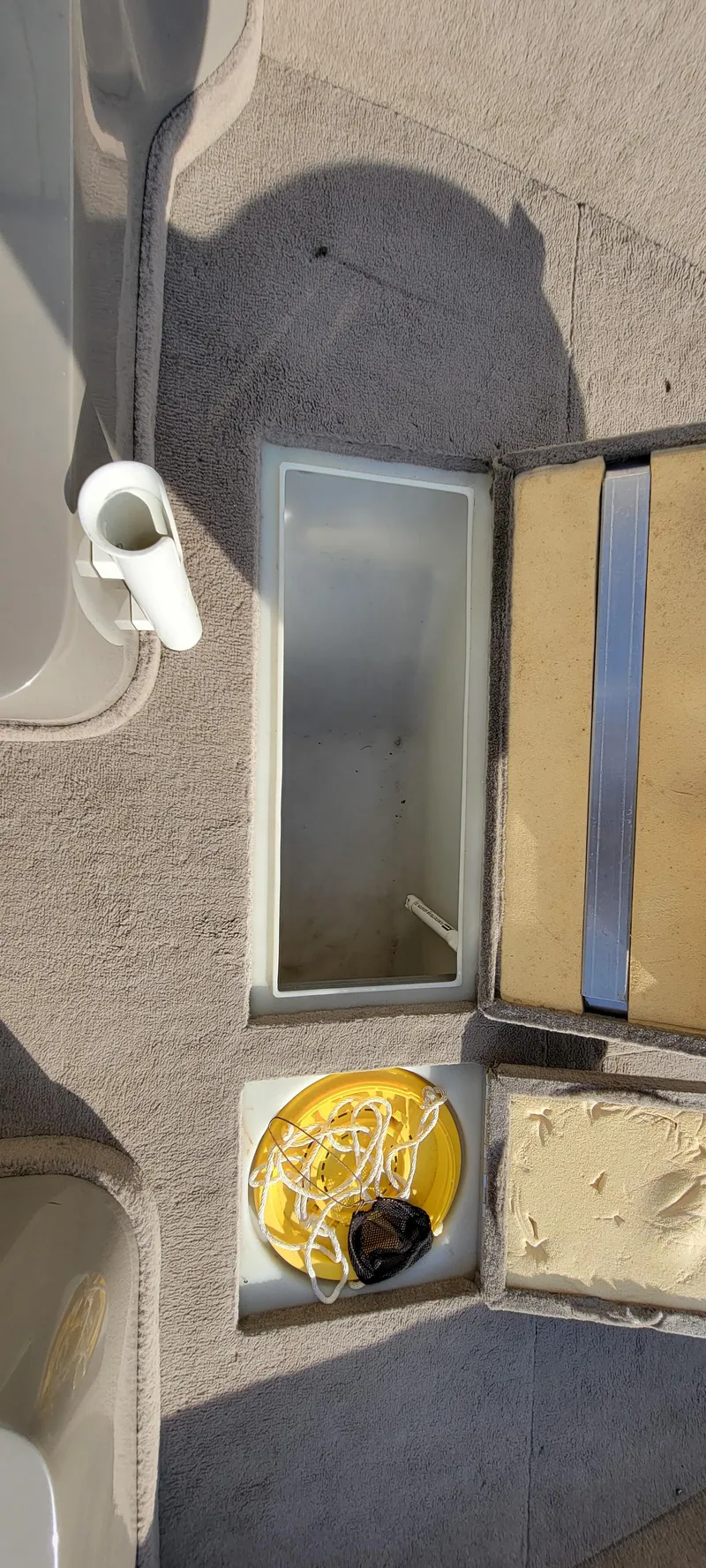 Slide: The Image of Interior of 2004 Sylvan F 1800 AVENGER boat with storage compartments and cup holder. - 16