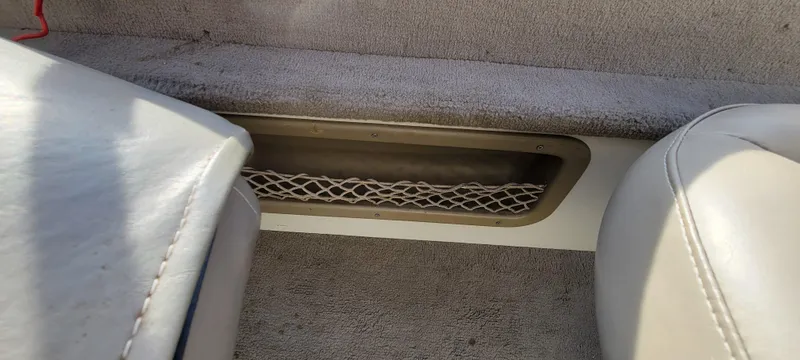 Slide: The Image of Interior of 2004 Sylvan F 1800 AVENGER boat with storage netting. - 20