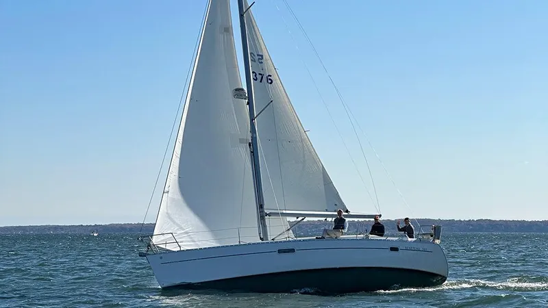 Slide: The Image of Sailing on open water, 1999 Beneteau 361 yacht with white sails and crew. - 1