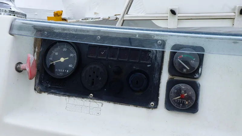 Slide: The Image of Control panel of a 1999 Beneteau 361 sailboat with gauges and switches. - 14