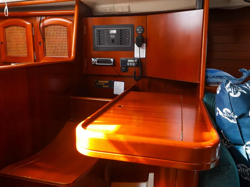 Slide: The Image of Interior of a 1999 Beneteau 361 sailboat with wooden navigation station. - 31