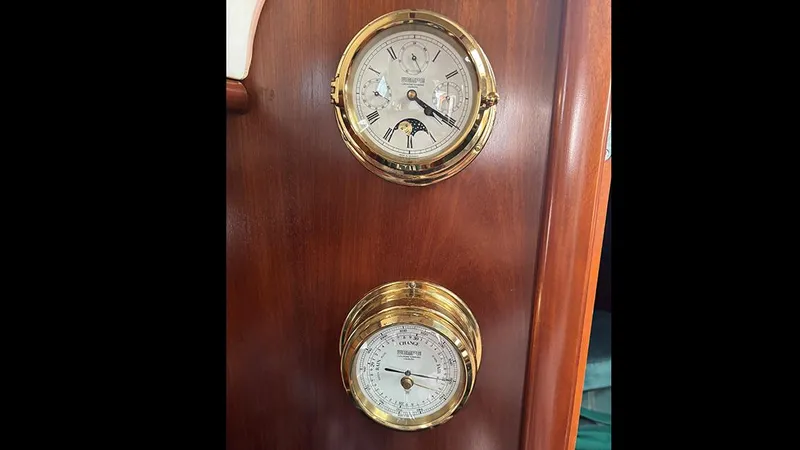 Slide: The Image of Brass nautical instruments on a Beneteau 361 yacht, 1999 model, mounted on wooden panel. - 32