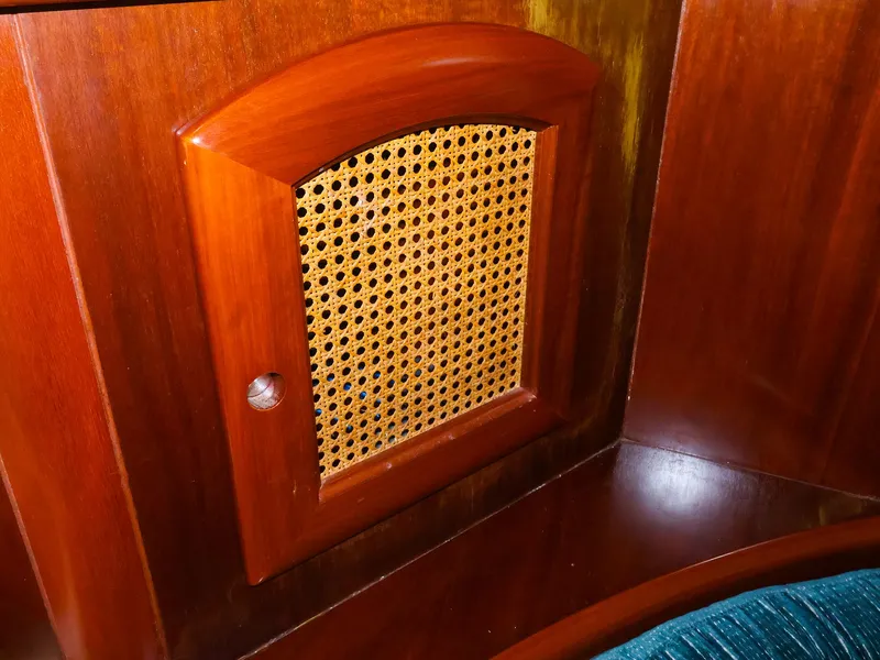 Slide: The Image of Wooden cabinet with woven panel on a 1999 Beneteau 361 sailboat interior. - 36