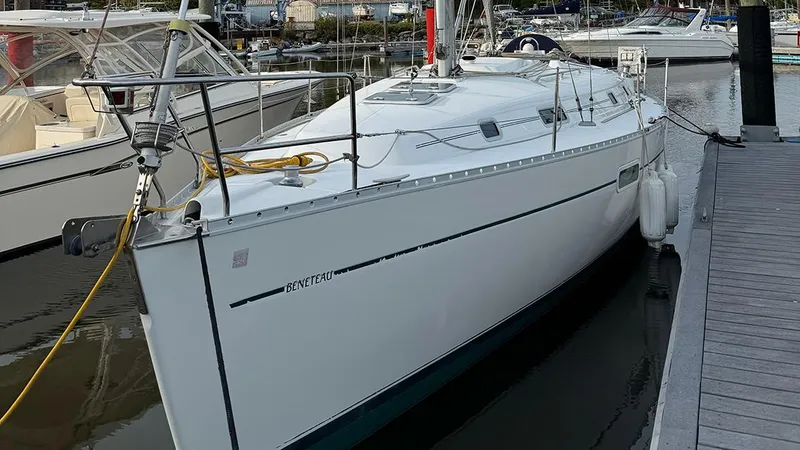 Slide: The Image of 1999 Beneteau 361 sailboat docked at marina, side view. - 4