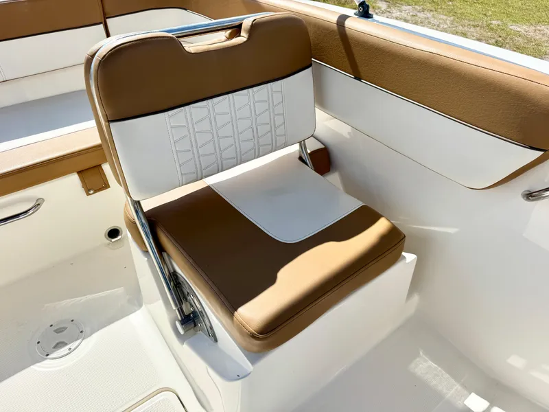 Slide: The Image of 2021 Bayliner VR5 OB boat seat with brown and white upholstery. - 12