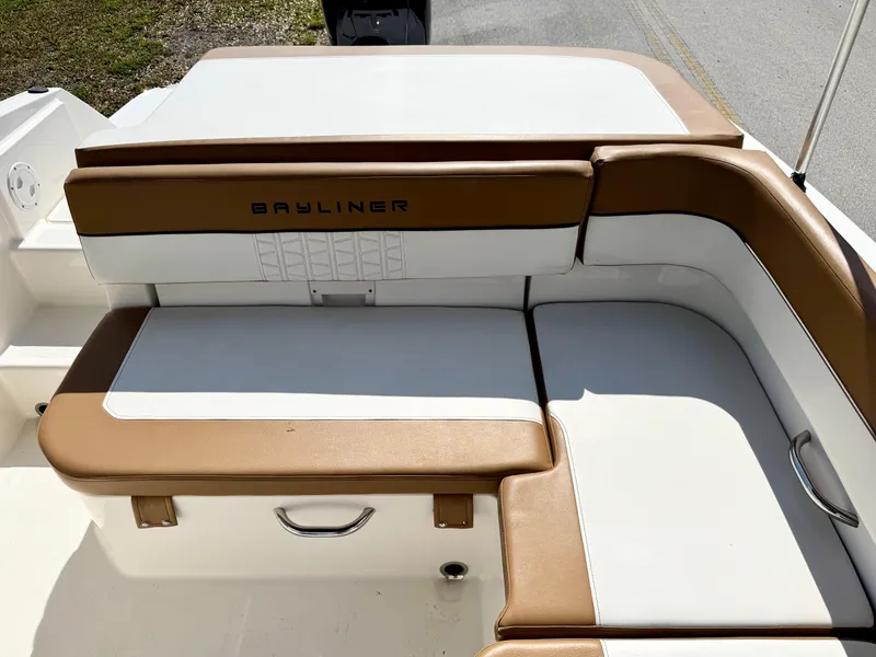 Slide: The Image of 2021 Bayliner VR5 OB boat seating area with tan and white upholstery. - 19