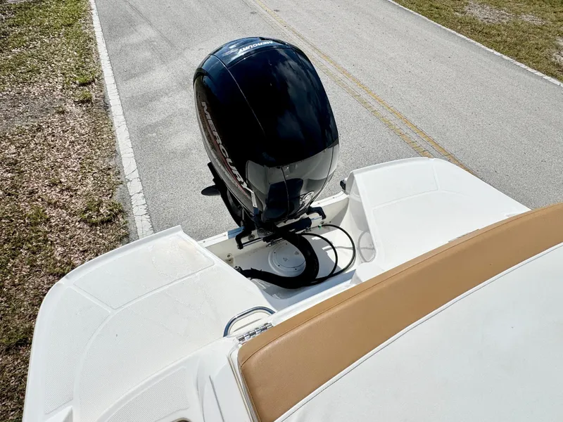 Slide: The Image of 2021 Bayliner VR5 OB boat with outboard motor on a road. - 22