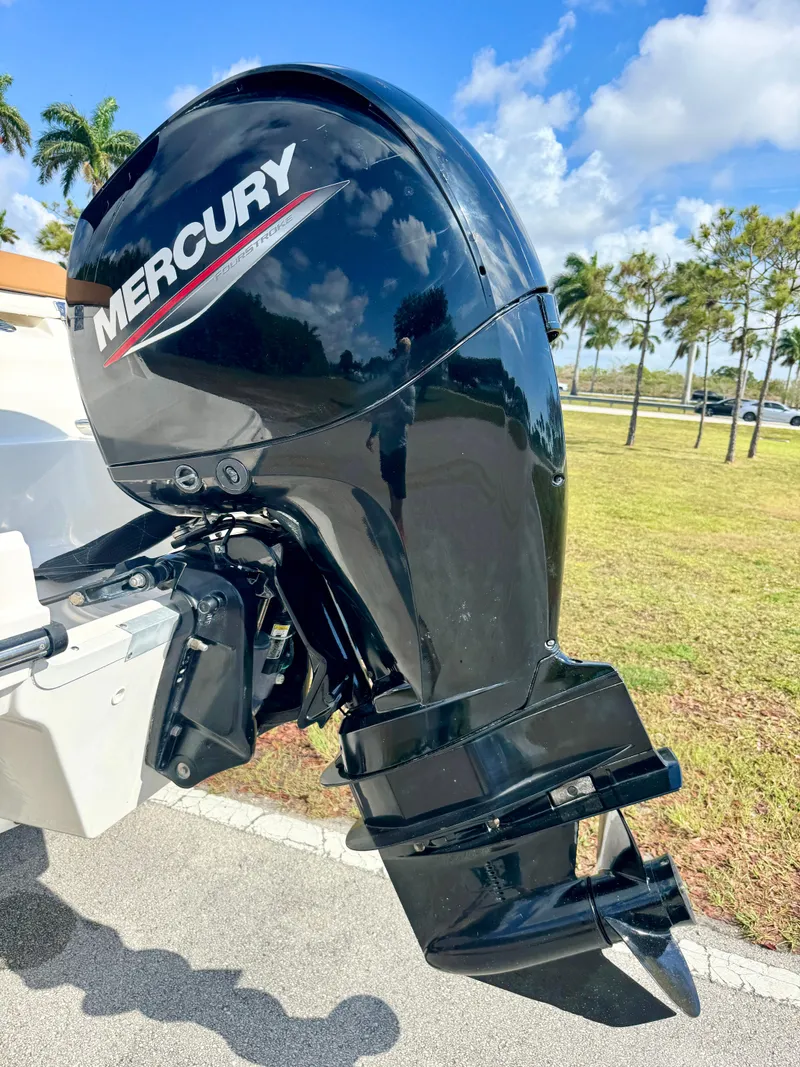 Slide: The Image of 2021 Bayliner VR5 OB with Mercury outboard motor, parked outdoors on a sunny day. - 27