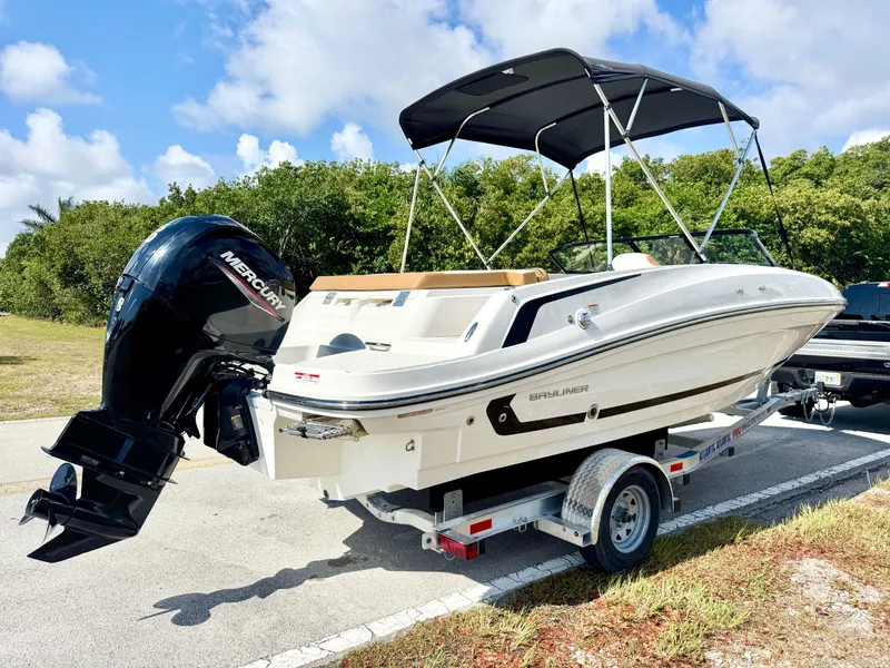 Slide: The Image of 2021 Bayliner VR5 OB boat on trailer, parked outdoors under blue sky. - 3
