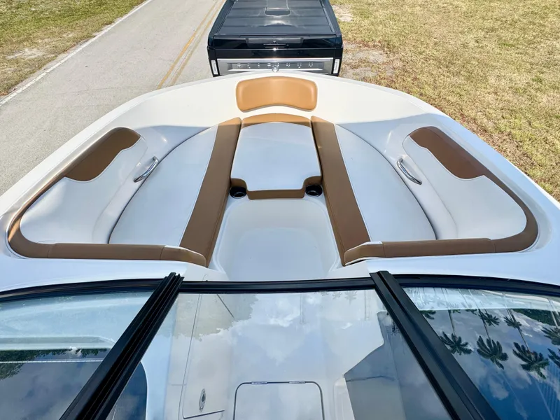 Slide: The Image of 2021 Bayliner VR5 OB boat interior with tan and white seating, viewed from above. - 7