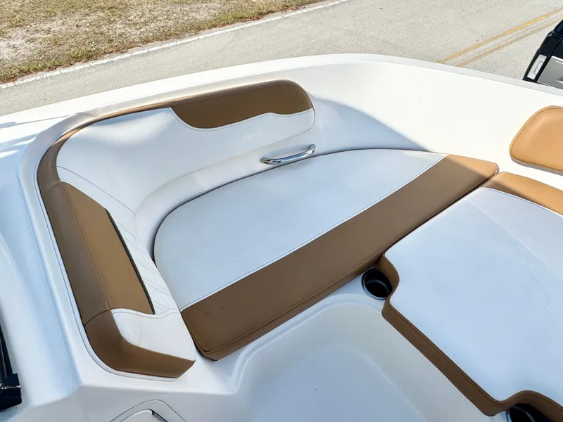 Slide: The Image of 2021 Bayliner VR5 OB boat interior with white and tan seating, showcasing modern design. - 8