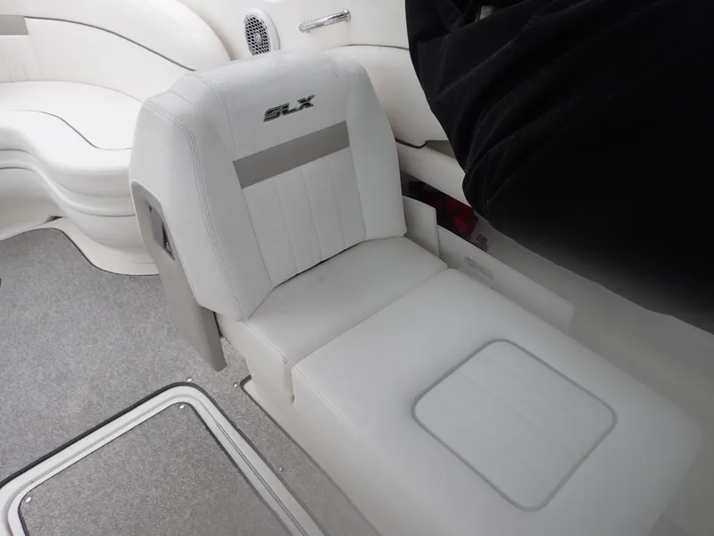 Slide: The Image of Luxurious interior seating of 2010 Sea Ray 300 SLX boat, featuring white upholstery. - 12