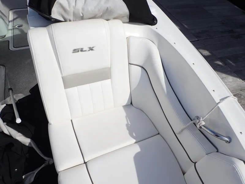 Slide: The Image of 2010 Sea Ray 300 SLX boat with white leather seating and SLX logo. - 18