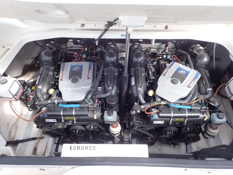 Slide: The Image of Twin engines in a 2010 Sea Ray 300 SLX boat, showcasing detailed mechanical components. - 21