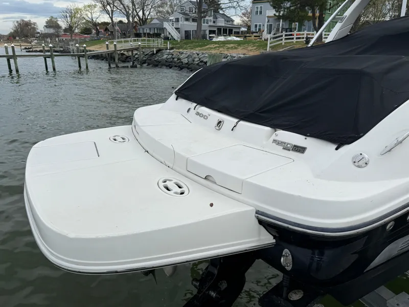 Slide: The Image of 2010 Sea Ray 300 SLX boat docked by waterfront homes. - 4