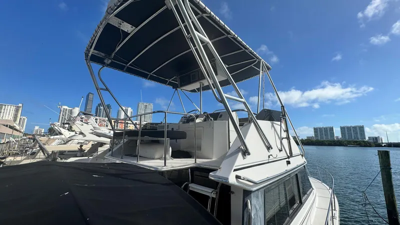 Slide: The Image of Catalina Islander 34 boat docked with city skyline in background, 1995 model. - 2