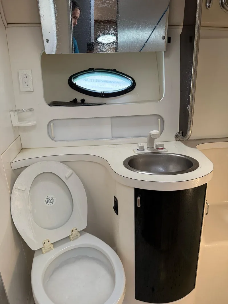 Slide: The Image of Bathroom interior of 1995 Catalina Islander 34 boat with toilet, sink, and mirror. - 4
