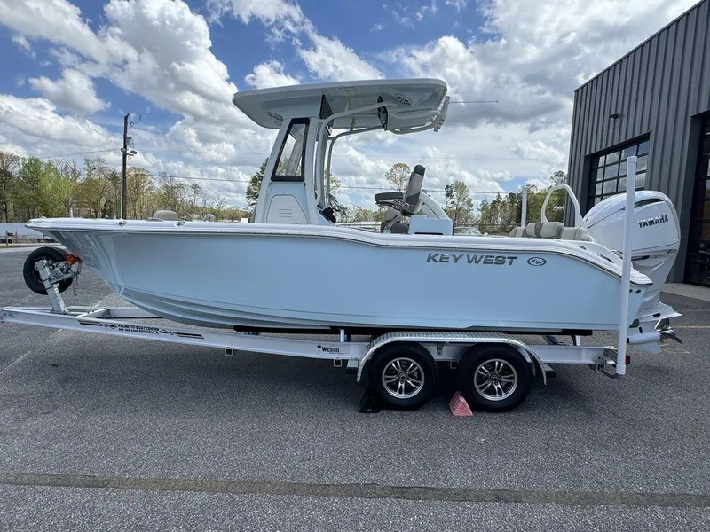 Slide: The Image of 2025 Key West 239 FSR boat with tan leather seating and modern design. - 7