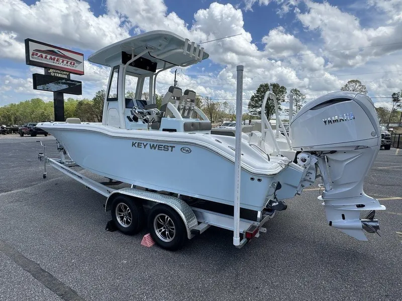 Slide: The Image of 2025 Key West 239 FSR boat interior with tan leather seating and armrests. - 8