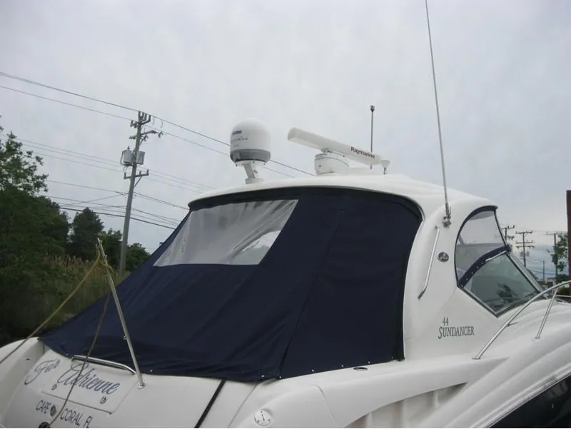 Slide: The Image of 2011 Sea Ray 540 Sundancer yacht with blue canopy and radar equipment. - 17