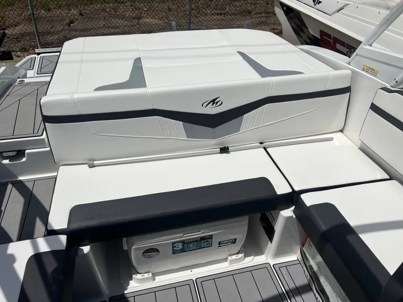 Slide: The Image of 2021 Monterey M22 boat interior with white and gray seating, featuring sleek design elements. - 6