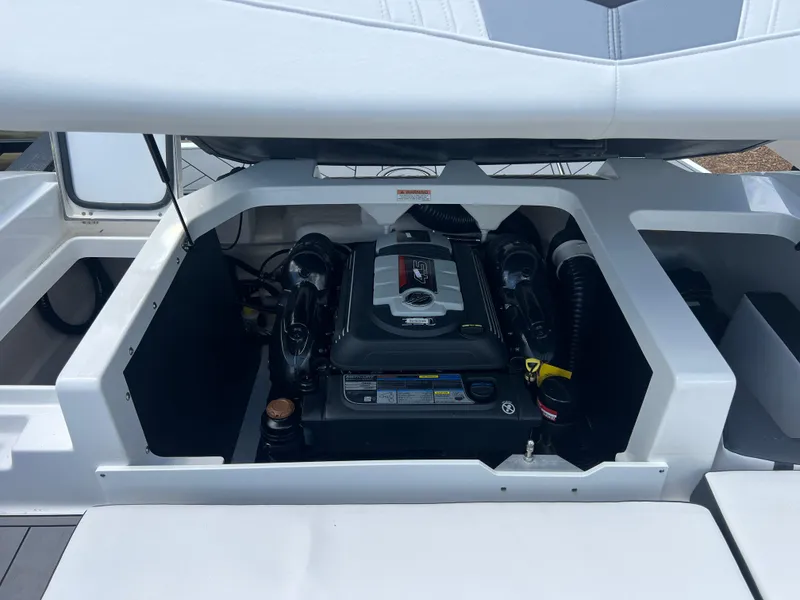 Slide: The Image of Engine compartment of a 2021 Monterey M22 boat, showcasing the engine details. - 8