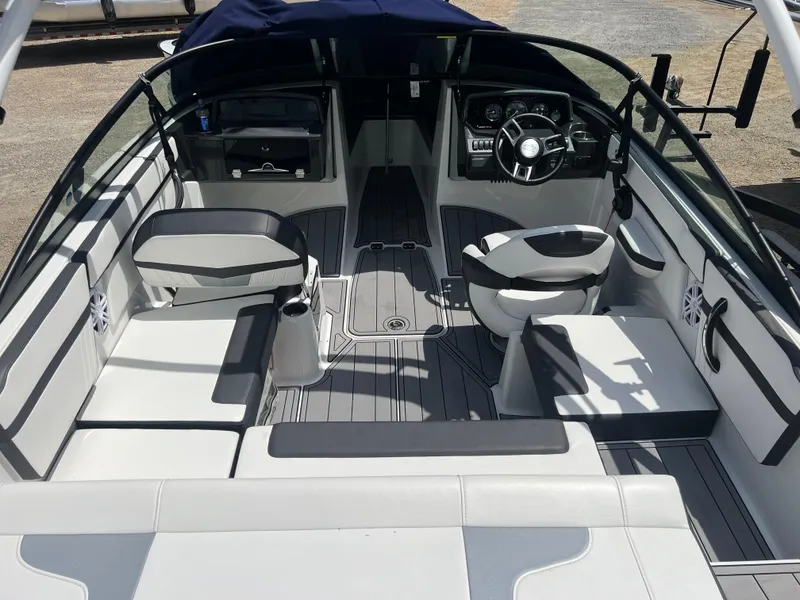 Slide: The Image of Interior of a 2021 Monterey M22 boat with modern seating and steering wheel. - 9