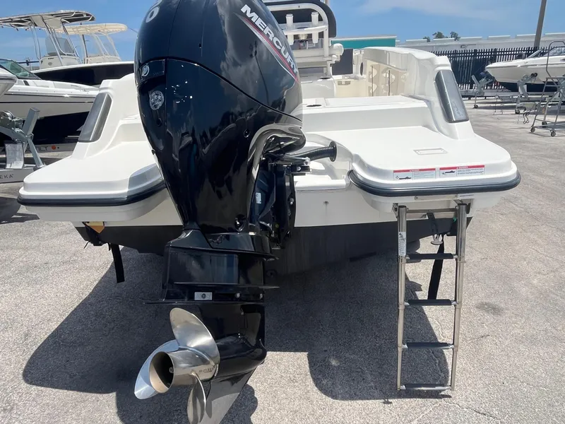 Slide: The Image of 2022 Bayliner Trophy T22CC boat with Mercury outboard motor and swim ladder. - 4