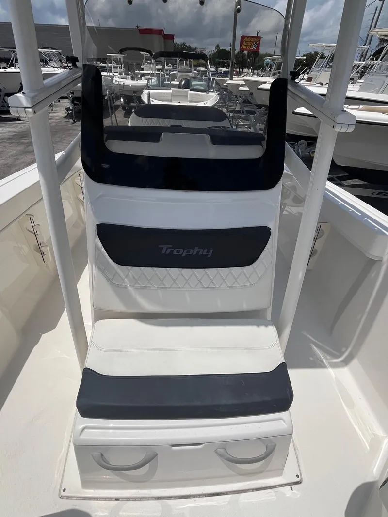 Slide: The Image of 2022 Bayliner Trophy T22CC boat interior with seating and storage compartments. - 9