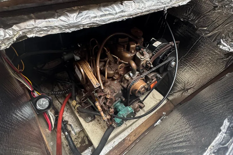 Slide: The Image of 1985 O'Day Sloop engine compartment with visible wiring and components. - 7
