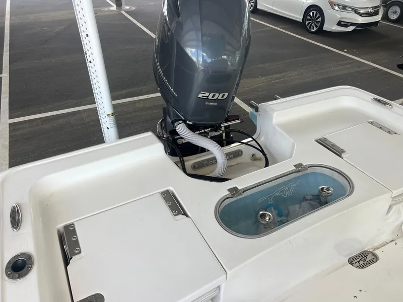 Slide: The Image of 2023 Tidewater 2110 boat with Yamaha 200 engine in parking area. - 14