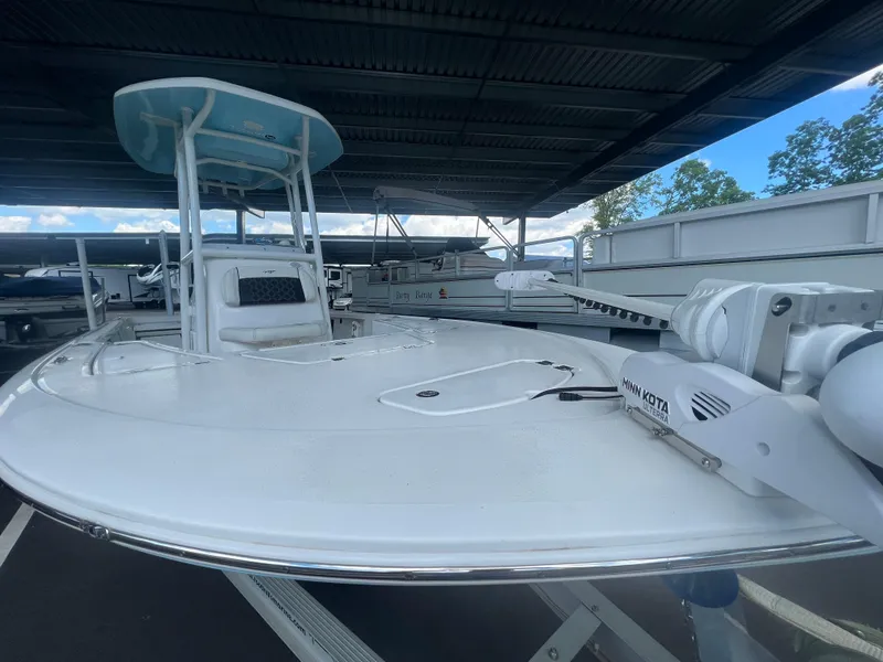 Slide: The Image of 2023 Tidewater 2110 boat with Minn Kota trolling motor under covered storage. - 3
