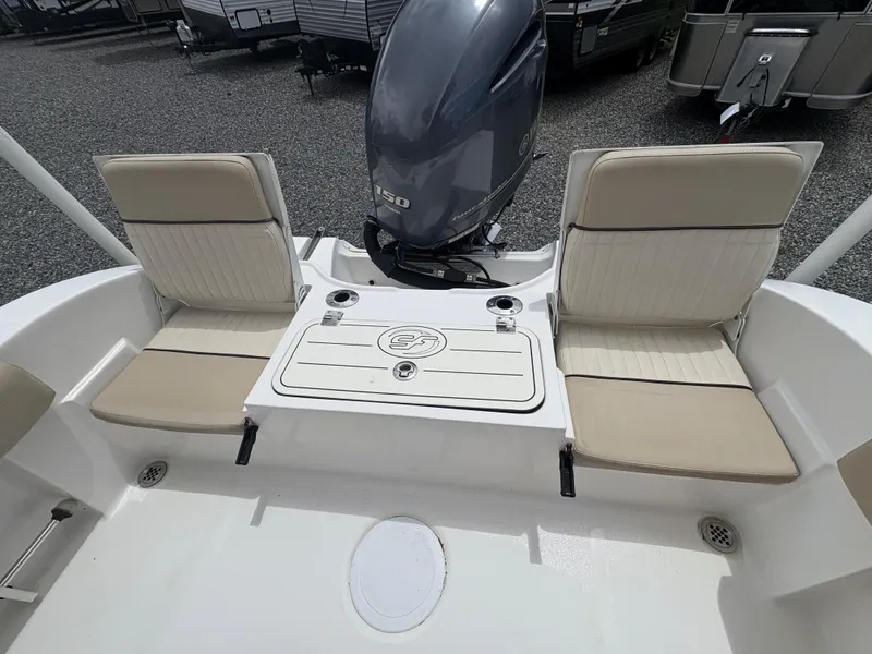 Slide: The Image of 2017 Sea Fox 206 Commander boat interior with seating and outboard motor. - 10