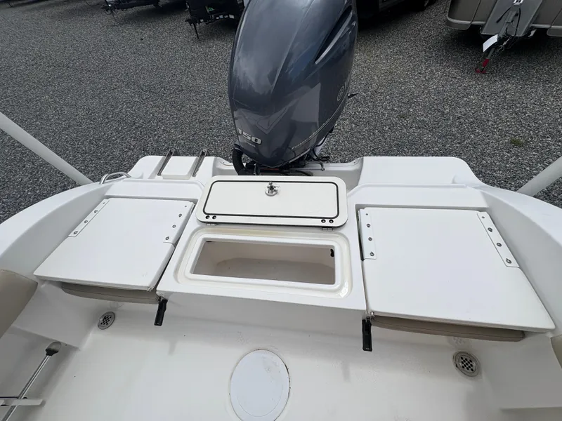 Slide: The Image of 2017 Sea Fox 206 Commander boat stern with motor and storage compartments. - 11